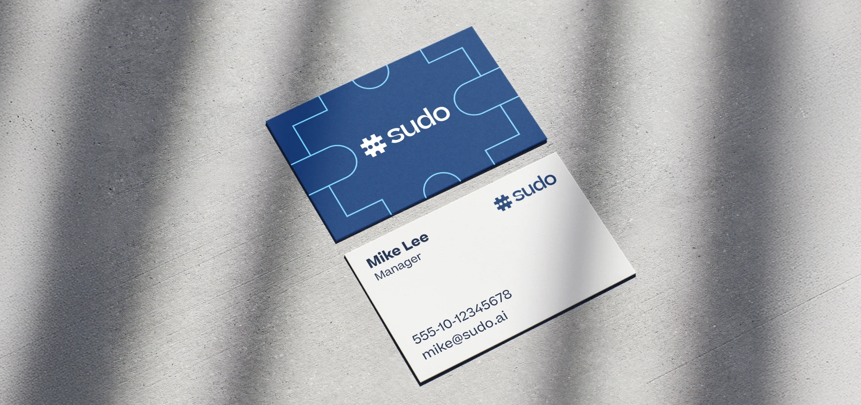 Sudo business card mockup with an outlined symbol on the reverse